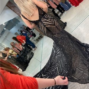 Black sequin Jovani dress worn once. In perfect condition.